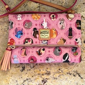 Dooney & Bourke Disney Dogs pink crossbody bag.